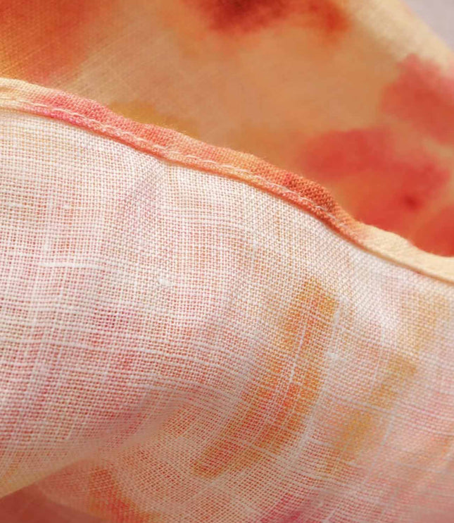 Sheer floral maxi dress fabric with soft orange and pink print, lightweight summer style