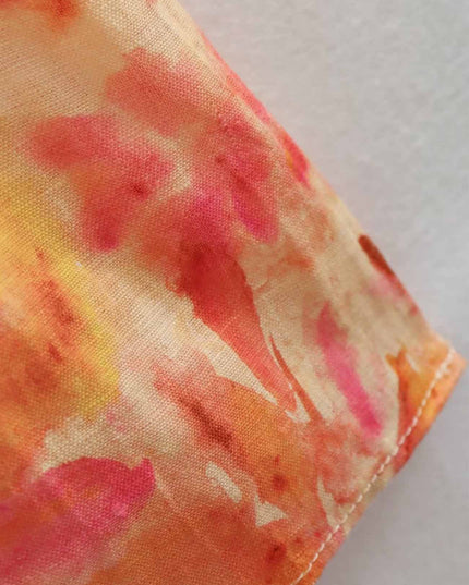 Floral maxi dress sleeve hem in orange, pink and yellow with stitched edge detail