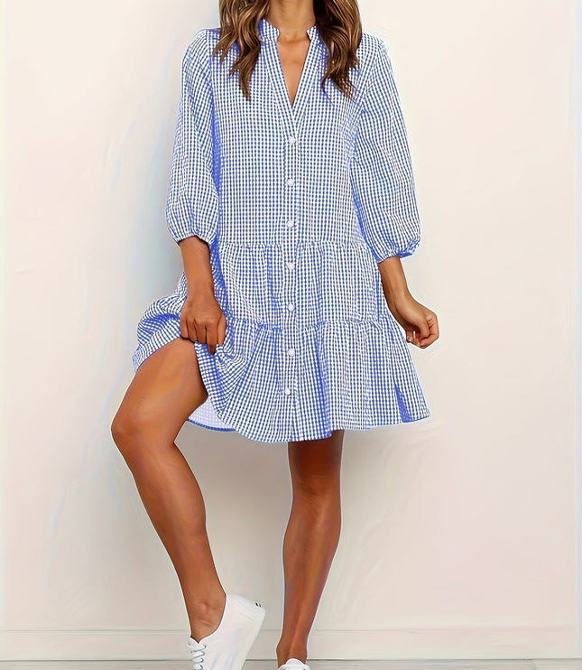 Blue gingham summer dress with V neck, long sleeves, and tiered mini skirt
