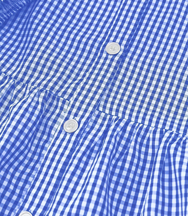 Close-up of blue gingham dress fabric with button front and gathered tier seam