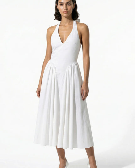 Black halter midi dress from the back with zipper closure and gathered skirt
