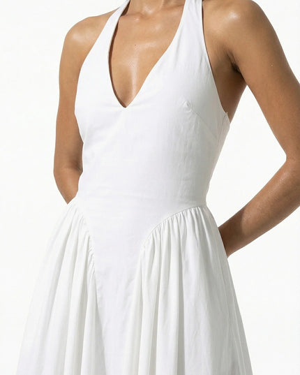 White halter midi dress with deep V neckline and flared skirt, front view