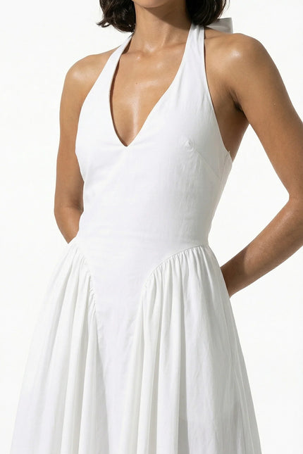 White halter midi dress with deep V neckline and flared skirt, front view