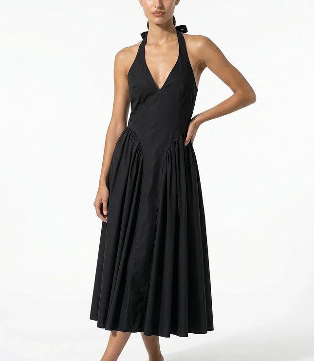 Black halter midi dress with deep V neckline and full pleated skirt, front view