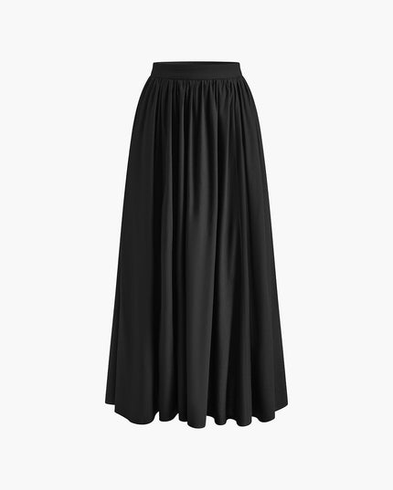 Black pleated maxi skirt on white background with high waist and full-length silhouette