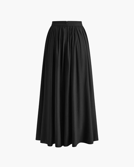 Black high waisted pleated maxi skirt with full flowy silhouette and fitted waistband