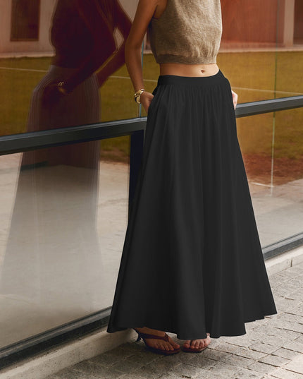 Black high waisted pleated maxi skirt with full A-line shape and side pockets