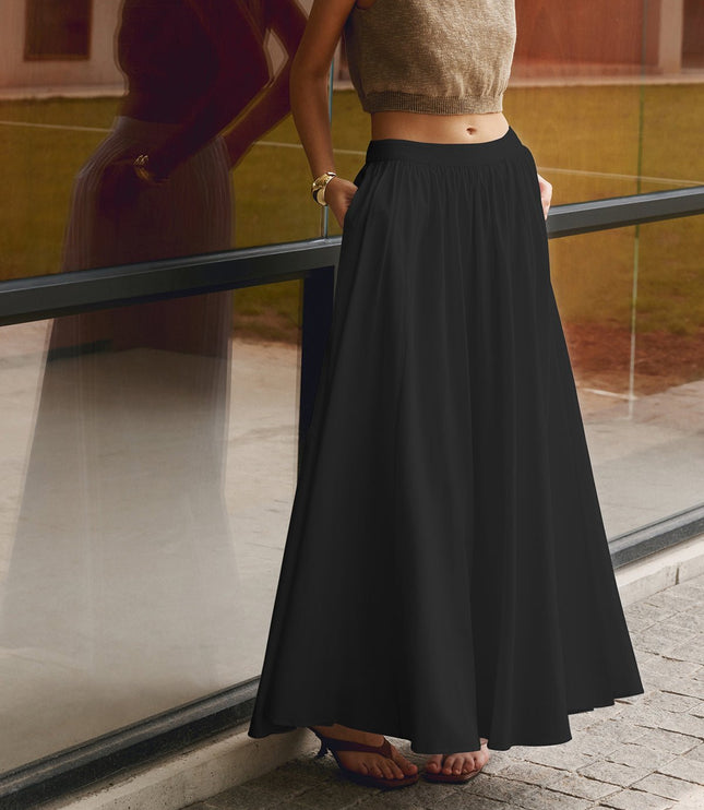 Black high waisted pleated maxi skirt with full A-line shape and side pockets