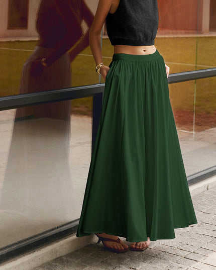 Dark green high waisted pleated maxi skirt with wide drape and side pockets