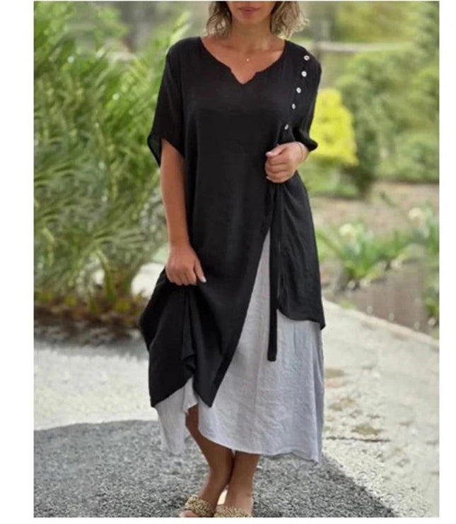 Black and white layered v-neck midi dress with draped overlay detail