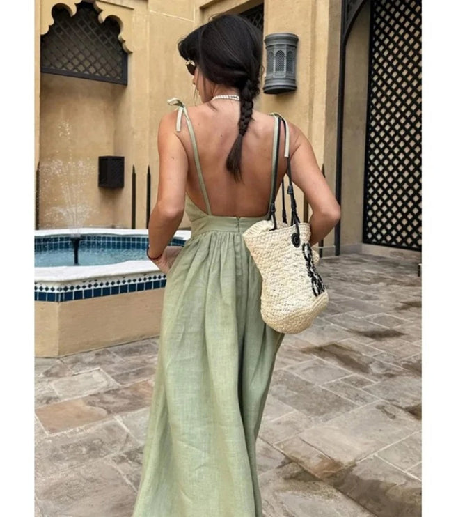 Back view of sage green linen maxi dress with open back and tie shoulder straps