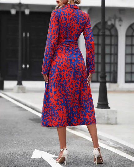 Back view of red and blue leopard print wrap midi dress with slit hem