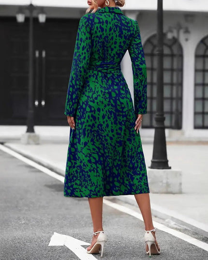 Back view of green and navy leopard print wrap midi dress showing slit