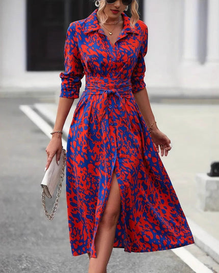 Red and blue leopard print wrap midi dress with three-quarter sleeves and tie waist