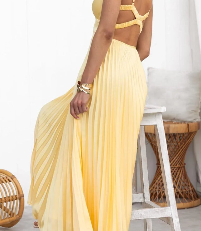 Back view of yellow pleated summer dress with open back straps and maxi skirt