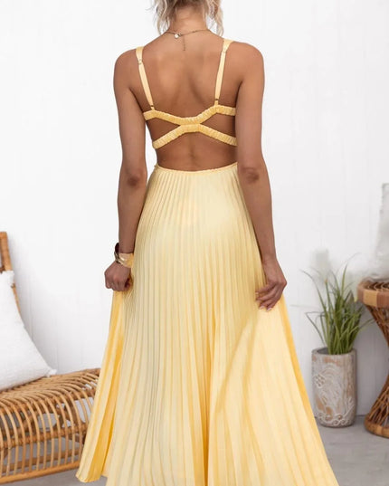Rear view of yellow V neck maxi dress with pleated skirt and crisscross back detail