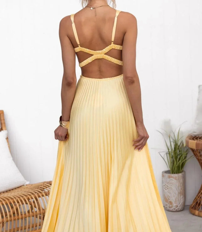 Rear view of yellow V neck maxi dress with pleated skirt and crisscross back detail
