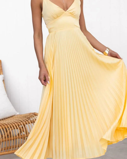 Yellow pleated V neck maxi dress with sleeveless bodice and flowing skirt, front view