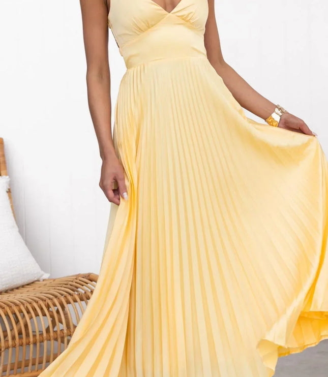Yellow pleated V neck maxi dress with sleeveless bodice and flowing skirt, front view