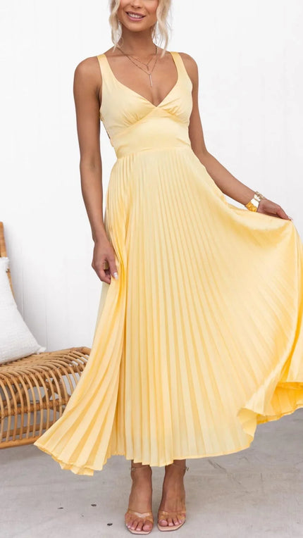 Yellow pleated V neck maxi dress with sleeveless bodice and flowing skirt, front view