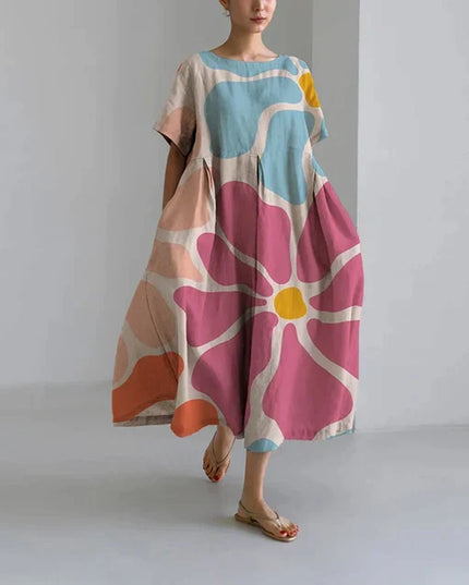 Loose midi dress with oversized pink and blue floral print, short sleeves, casual summer dress