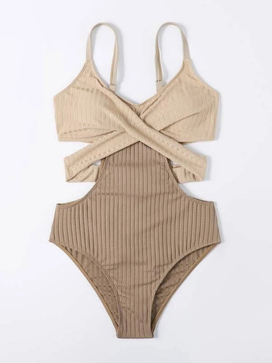 Front view of beige ribbed one piece swimsuit with thin straps and wrap style cut out design