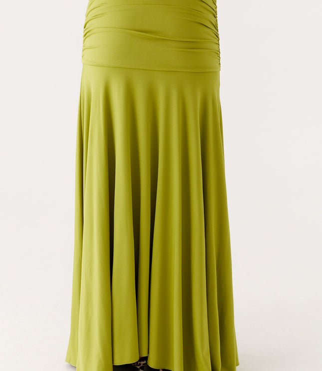 Back close-up of lime green maxi dress showing ruched waist panel and flowing skirt fabric