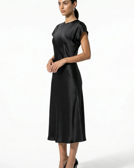 Side view of black satin midi dress with cap sleeves and midi length