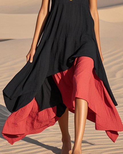 Detailed view of the layered black and red asymmetrical hem of the midi sundress.