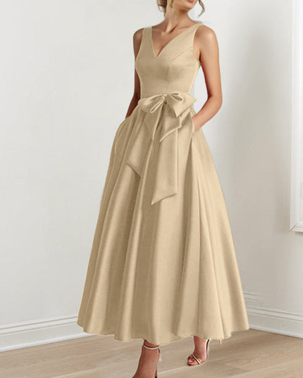 Champagne V-neck sleeveless A-line satin maxi dress with bow detail