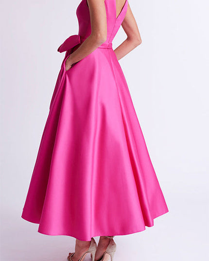 pink satin A-line maxi dress back view with V-neck and side bow