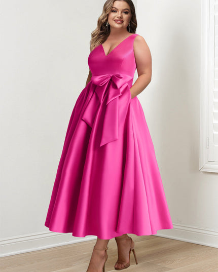 Plus size pink A-line satin maxi dress with V-neck and bow detail