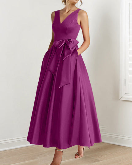 Deep magenta A-line maxi dress with V-neck and waist bow detail