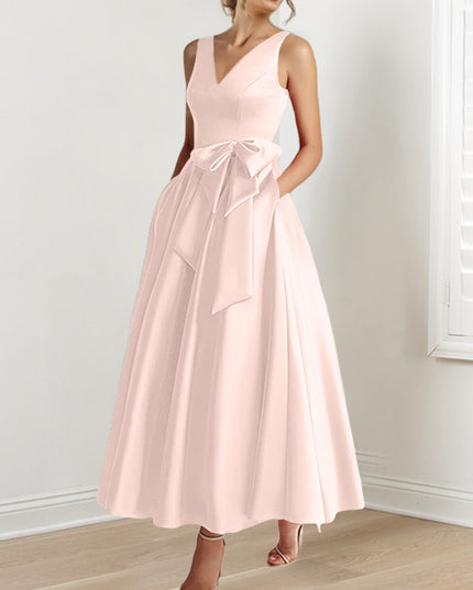 Blush pink A-line satin maxi dress with V-neckline and waist sash