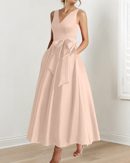Pale pink sleeveless A-line maxi dress with V-neck and bow waist