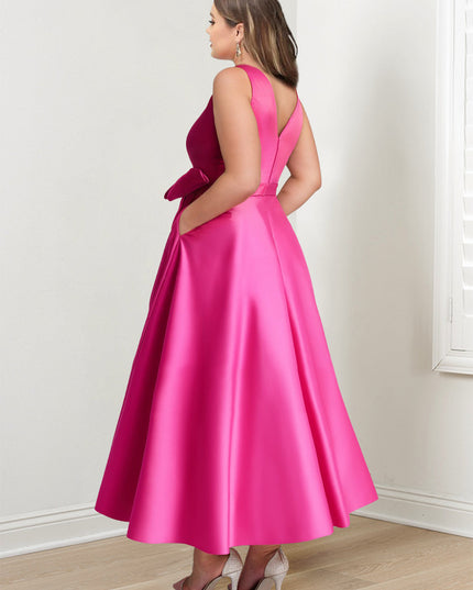 pink A-line satin maxi dress back view showing V-neck and bow waist