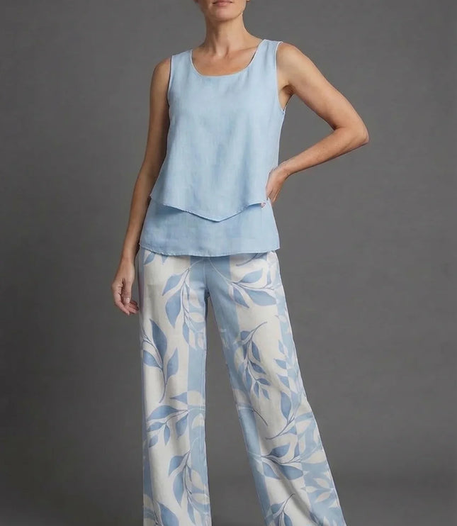 Front view of light blue sleeveless top and matching wide leg floral pants co ord set