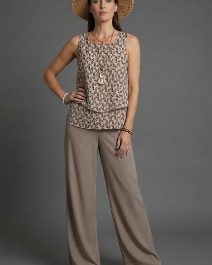 Beige sleeveless patterned top with loose wide leg linen pants and straw hat co ord set