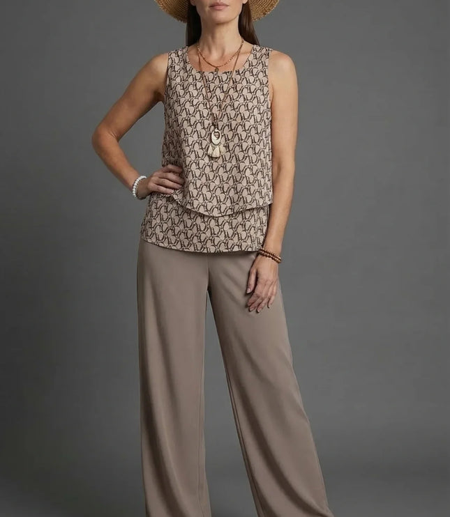 Beige sleeveless patterned top with loose wide leg linen pants and straw hat co ord set