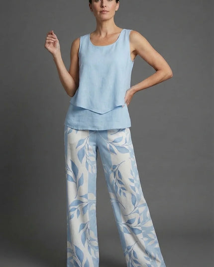 Light blue sleeveless crop top with wide leg floral print pants in a summer co ord set