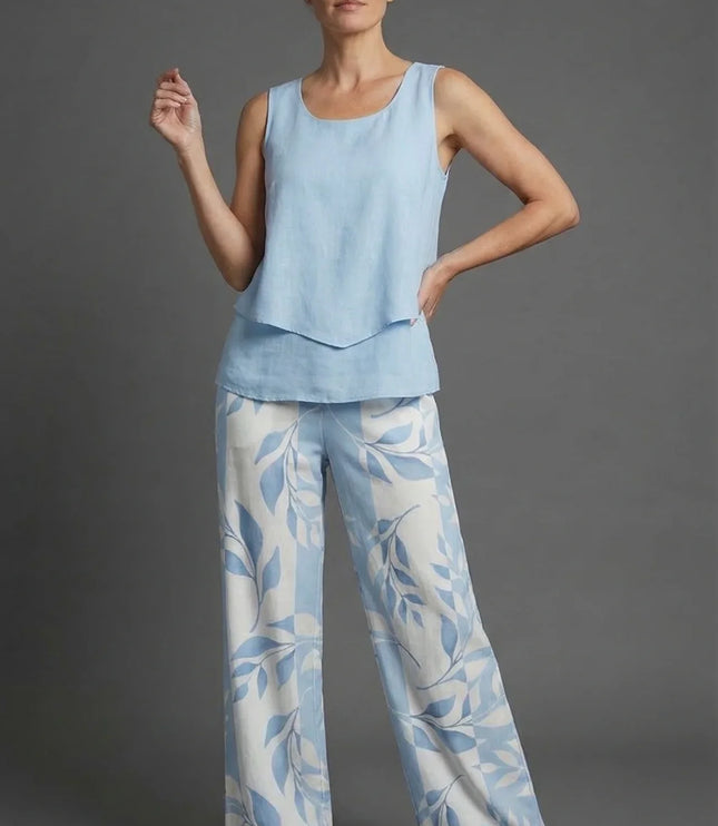 Light blue sleeveless crop top with wide leg floral print pants in a summer co ord set