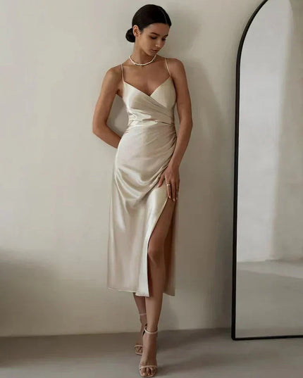Front view of ivory satin wrap maxi dress with v-neckline and side ruching