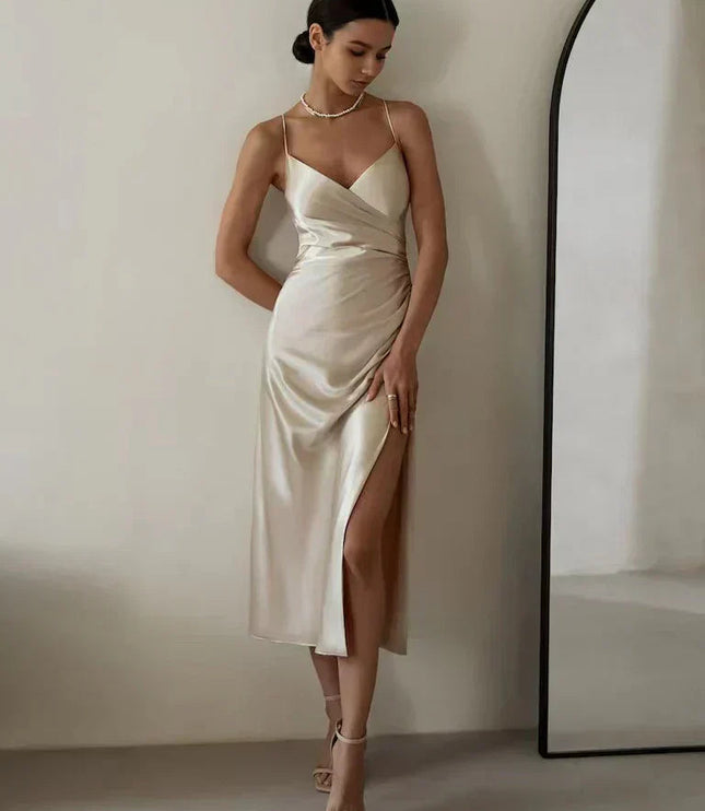 Front view of ivory satin wrap maxi dress with v-neckline and side ruching
