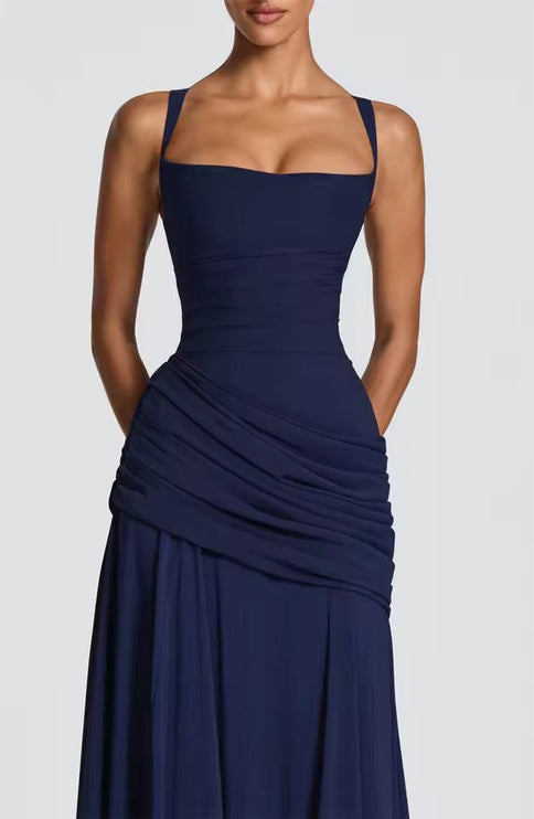 Navy blue formal maxi dress close-up showing sweetheart neckline and ruched asymmetrical waist