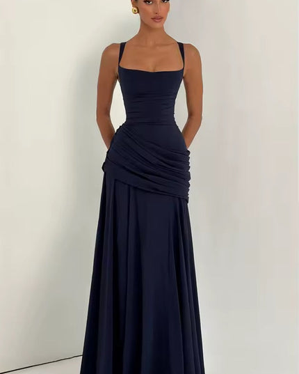 Navy sweetheart neckline asymmetrical maxi dress with ruched waist and flowing skirt
