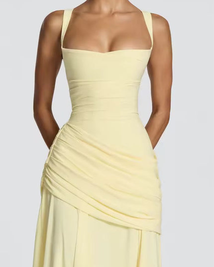 Close-up of pale yellow sweetheart formal dress with ruched waist detail