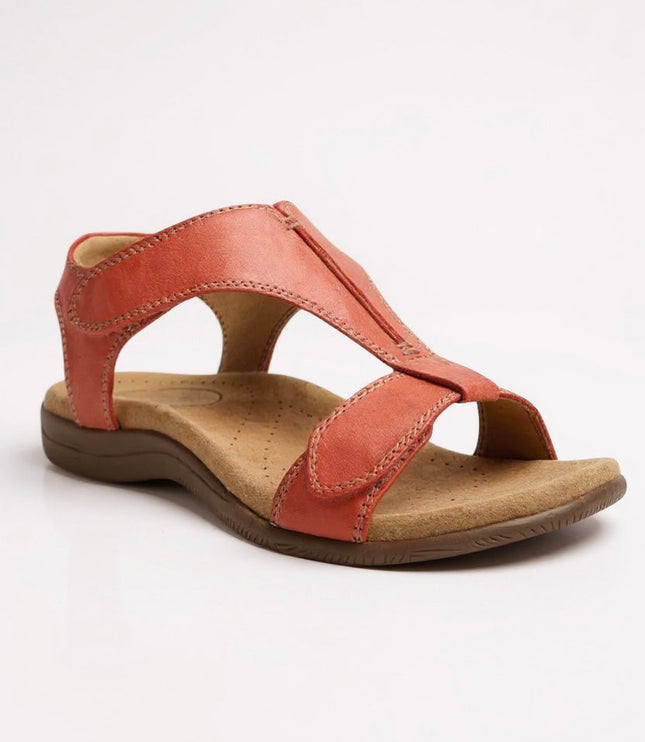 Coral leather t-strap sandal with perforated cushioned sole and velcro closure