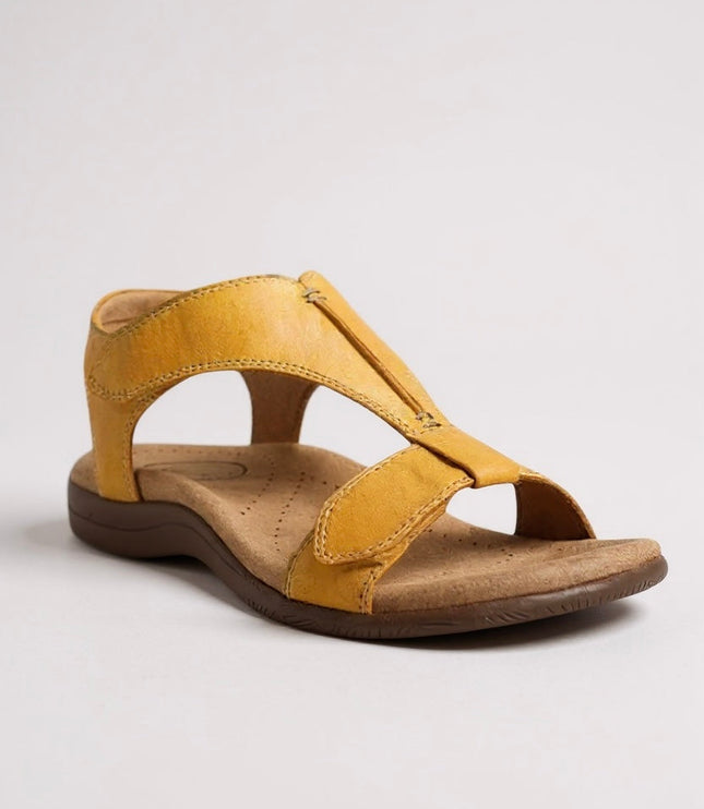 Golden yellow leather t-strap sandal with cushioned arch support and adjustable strap