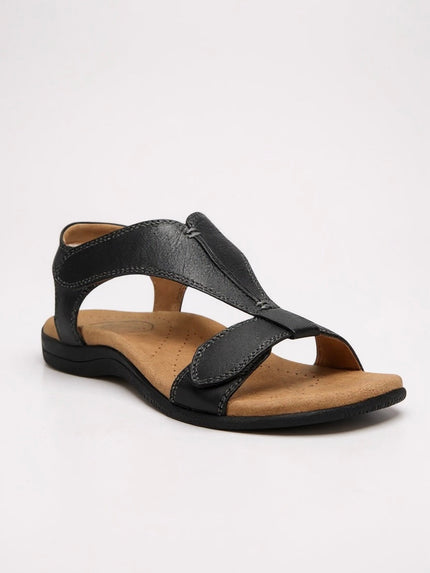 Black leather t-strap sandal with cushioned cork footbed and stitched details