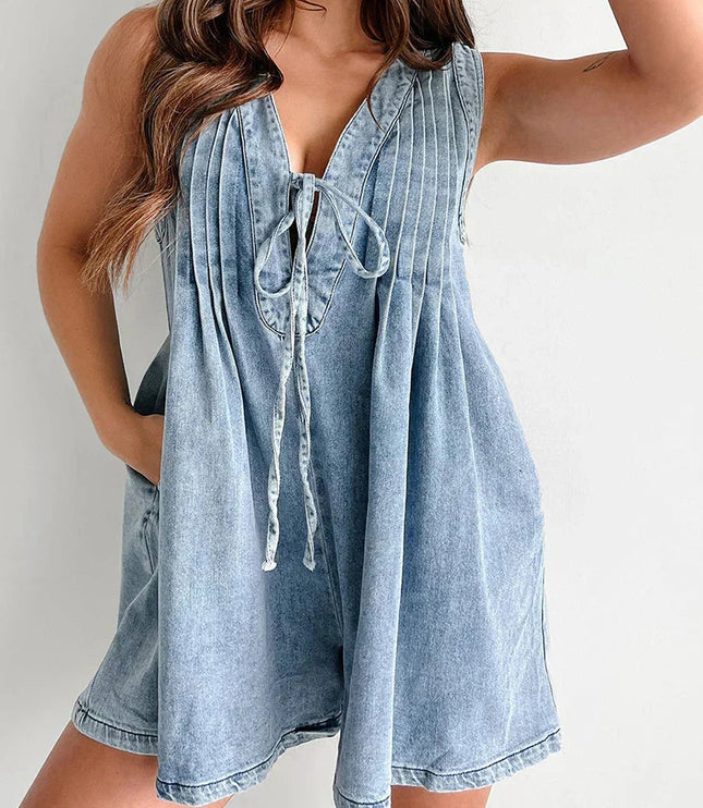 Light blue denim mini dress with tie front v-neck and pleated bodice